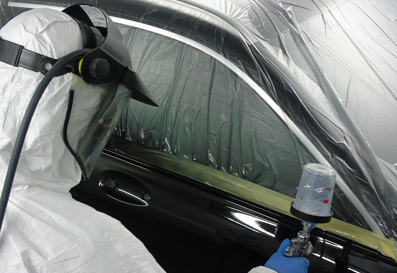 spraying a car